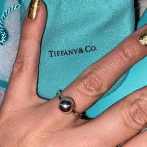Brand new Tiffany ball ring size 5. Bag and box included
